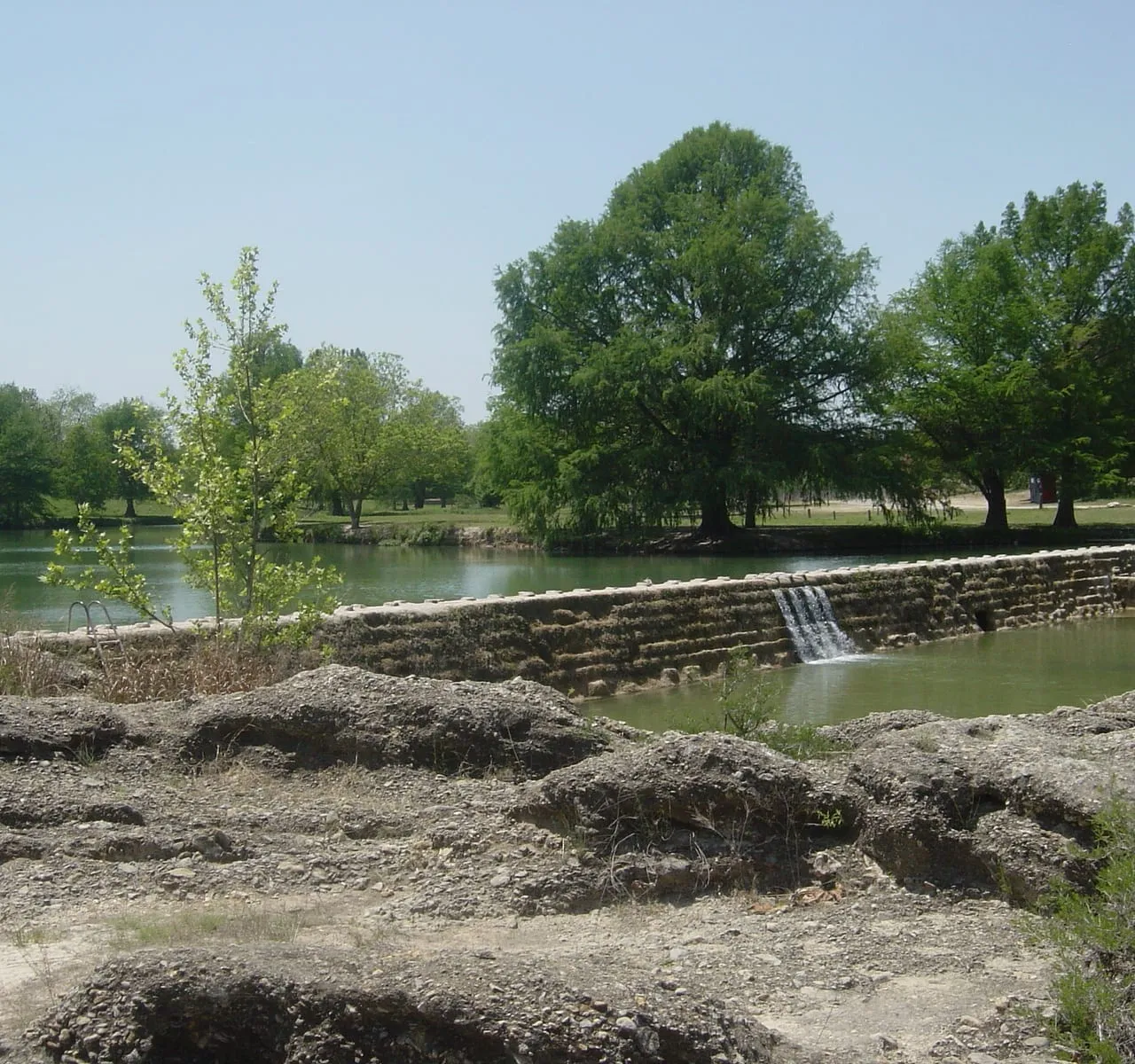 The Blanco River flowing over a stone dam at Blanco, Texas