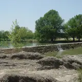 The Blanco River flowing over a stone dam at Blanco, Texas