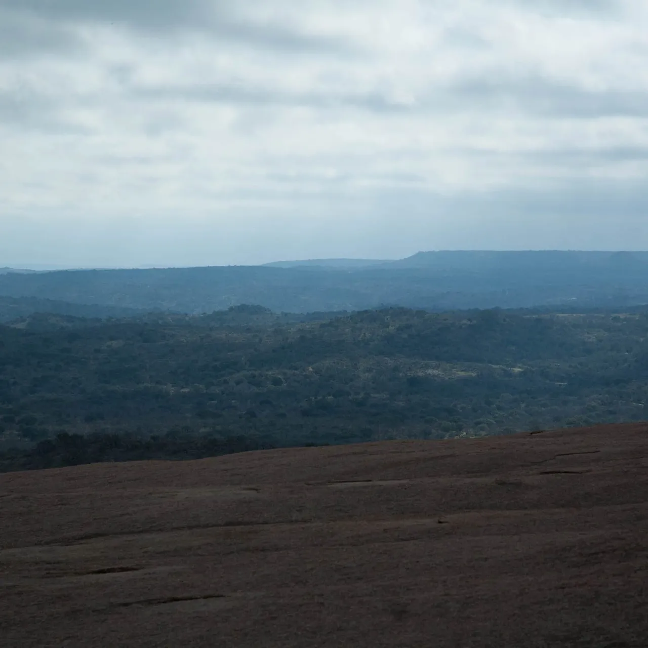 The exposed granite summit of Enchanted Rock, where sun protection is critical