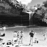 Hamilton Pool Preserve waterfall cascading over the limestone grotto near Dripping Springs, Texas