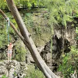 The grotto and rope swing at Krause Springs near Spicewood, Texas