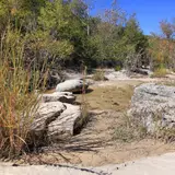 Rock stepping stones used for creek crossing on a hiking trail at Lost Maples
