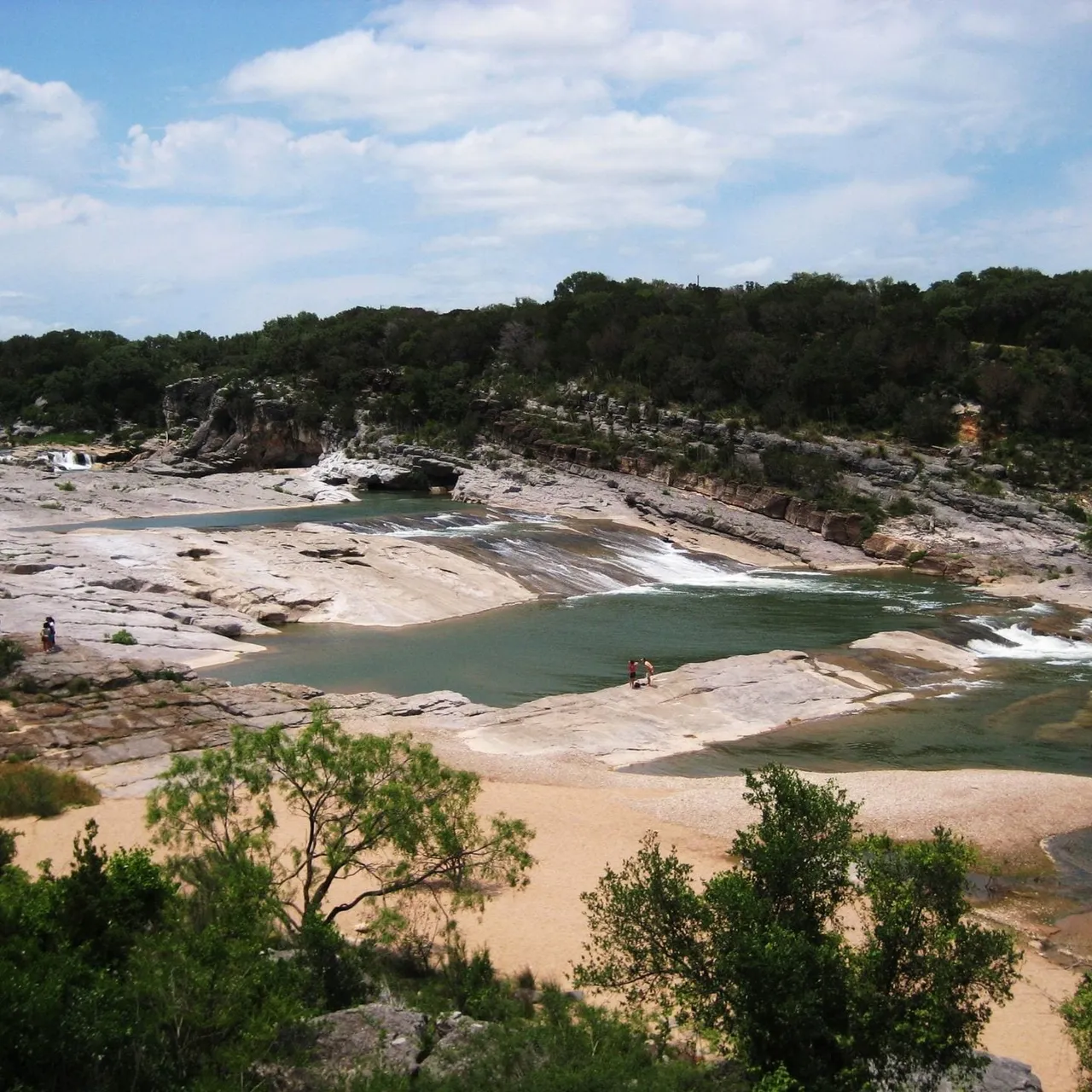 Pedernales Falls cascading over tilted limestone layers at Pedernales Falls State Park, Texas